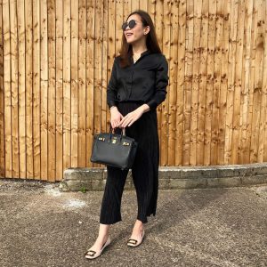 Eileen from Colourful Noir with her black Hermès Birkin Bag 25