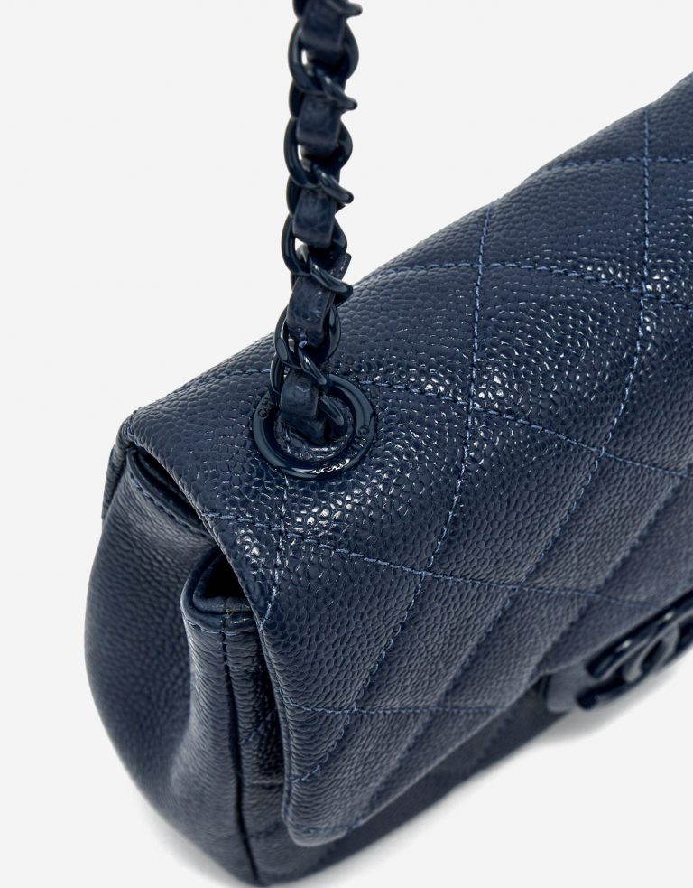 Interwoven chain strap of a pre-loved Chanel Timeless Mini Caviar Blue Incognito on SACLÀB