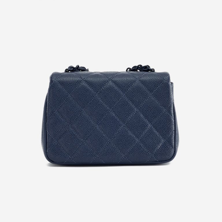 Backside of a pre-loved Chanel Timeless Mini Caviar Blue Incognito on SACLÀB