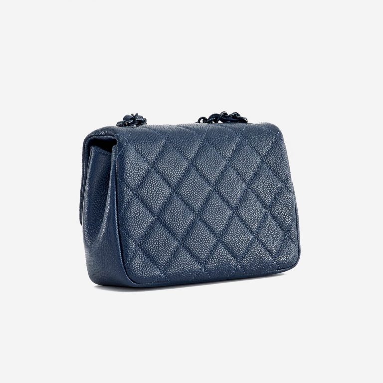 Backside of a pre-loved Chanel Timeless Mini Caviar Blue Incognito on SACLÀB