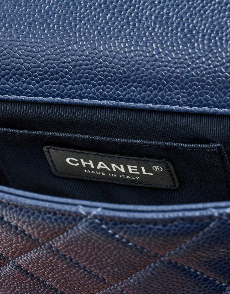 Chanel logo detail of a pre-loved Chanel Timeless Mini Caviar Blue Incognito on SACLÀB