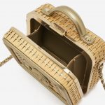 A pre-loved small Chanel Vanity Case in Beige Straw and Gold Leather on SACLÀB