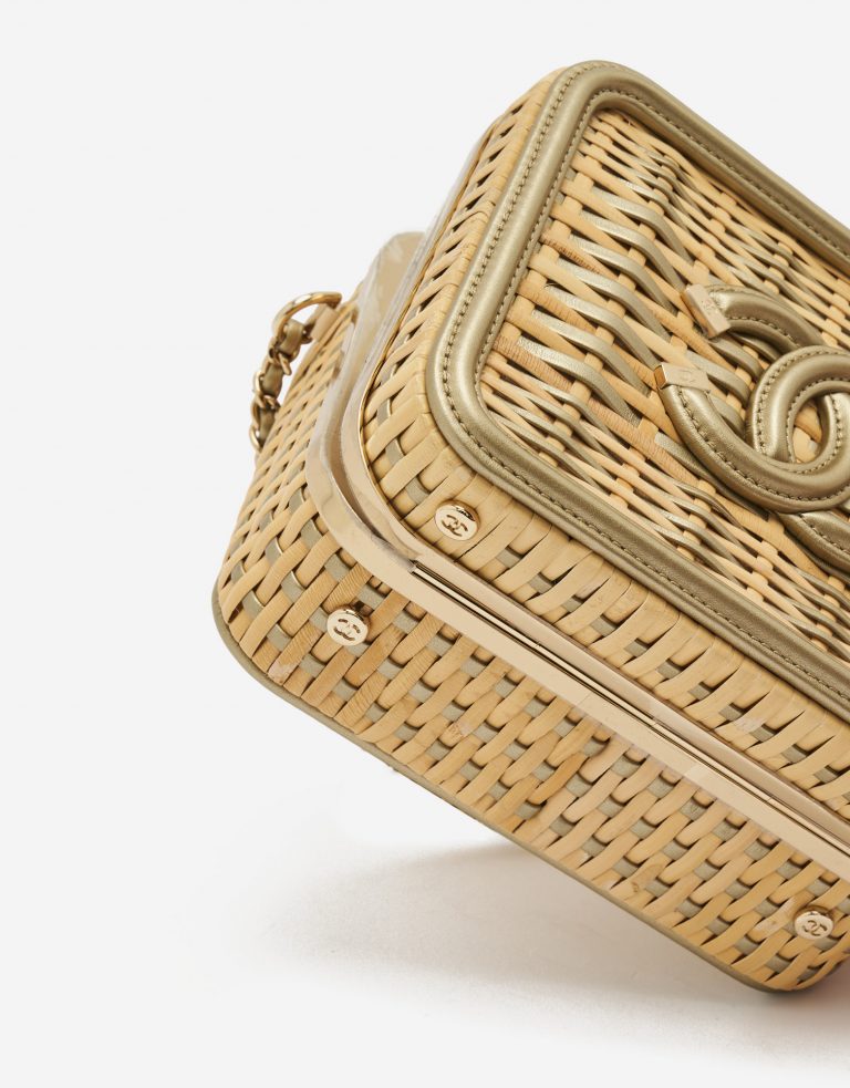 A pre-loved small Chanel Vanity Case in Beige Straw and Gold Leather on SACLÀB