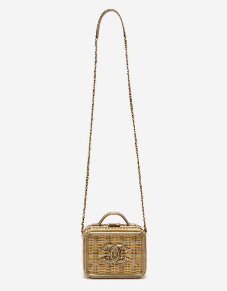 A pre-loved small Chanel Vanity Case in Beige Straw and Gold Leather on SACLÀB