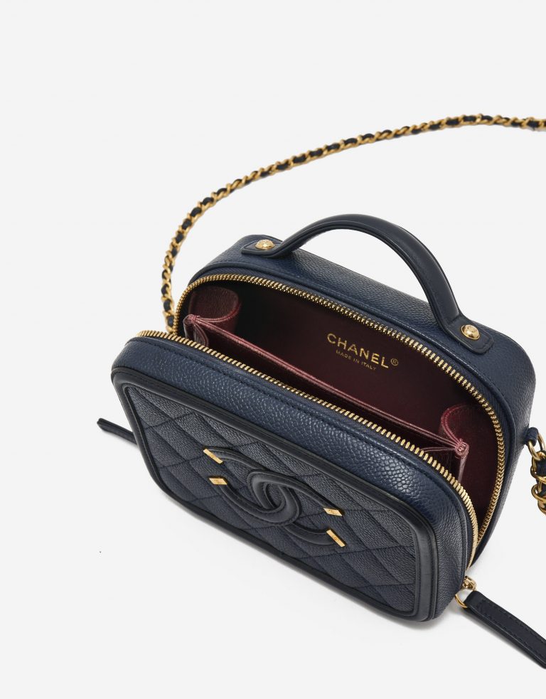 A pre-loved Chanel Vanity Case Small Caviar Leather in Dark Blue on SACLÀB