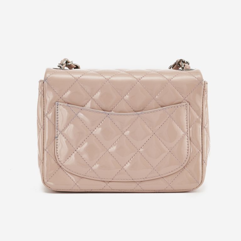 A pre-loved Chanel Timeless Mini Square in Nude Patent Leather on SACLÀB