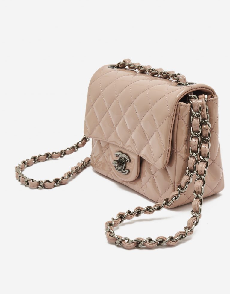 A pre-loved Chanel Timeless Mini Square in Nude Patent Leather on SACLÀB