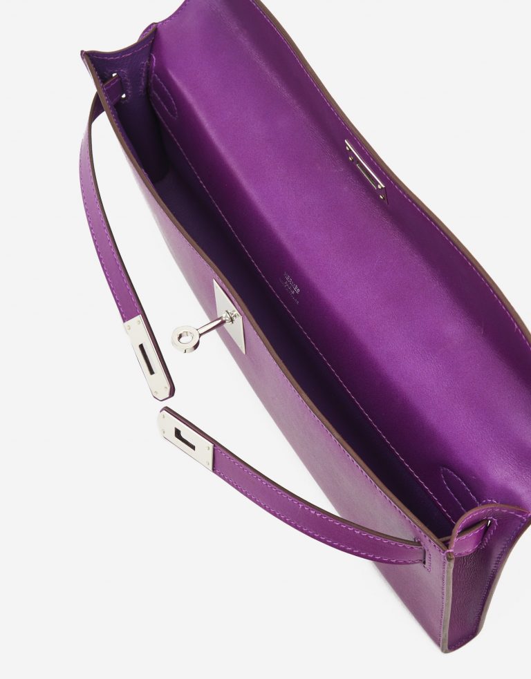 A pre-loved Hermès Kelly Cut Clutch in Anemone Swift Leather on SACLÀB