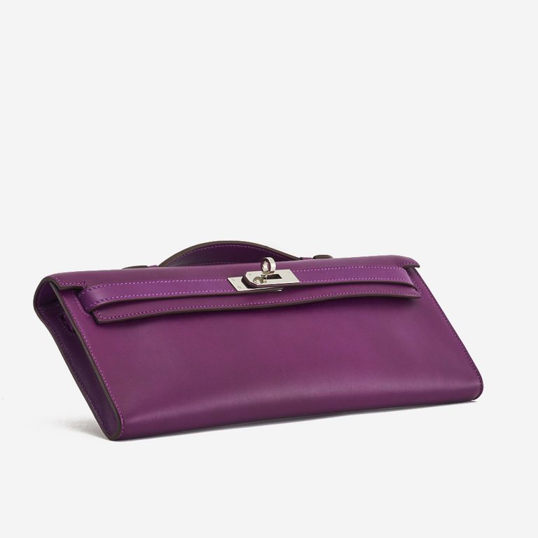 A pre-loved Hermès Kelly Cut Clutch in Anemone Swift Leather on SACLÀB