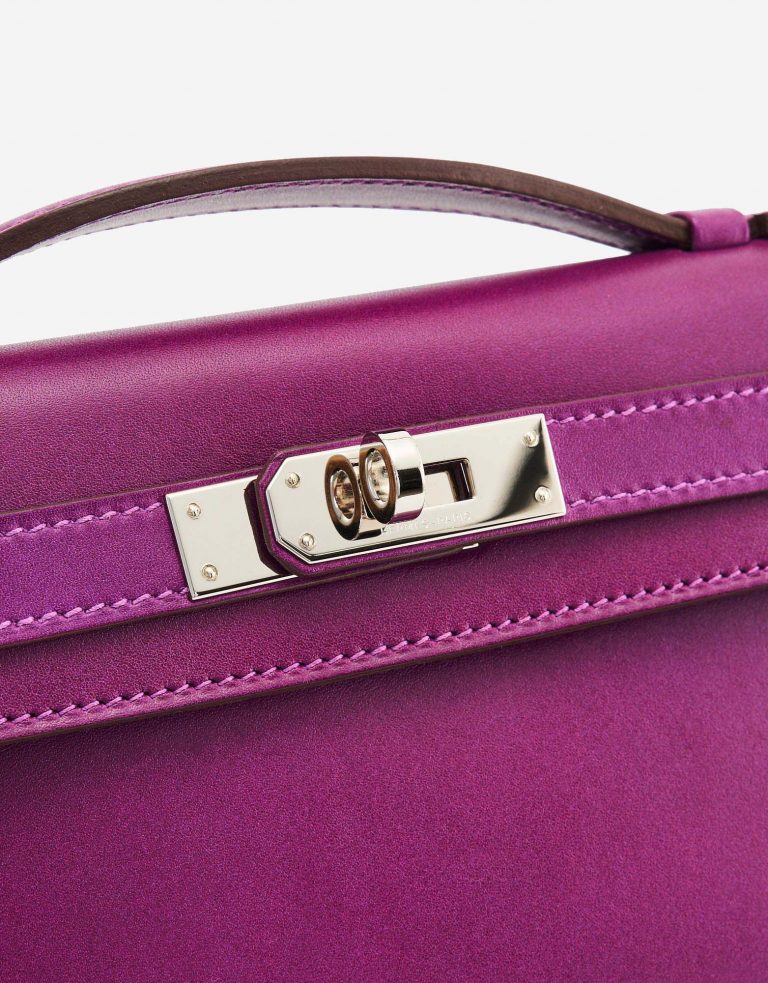 A pre-loved Hermès Kelly Cut Clutch in Anemone Swift Leather on SACLÀB