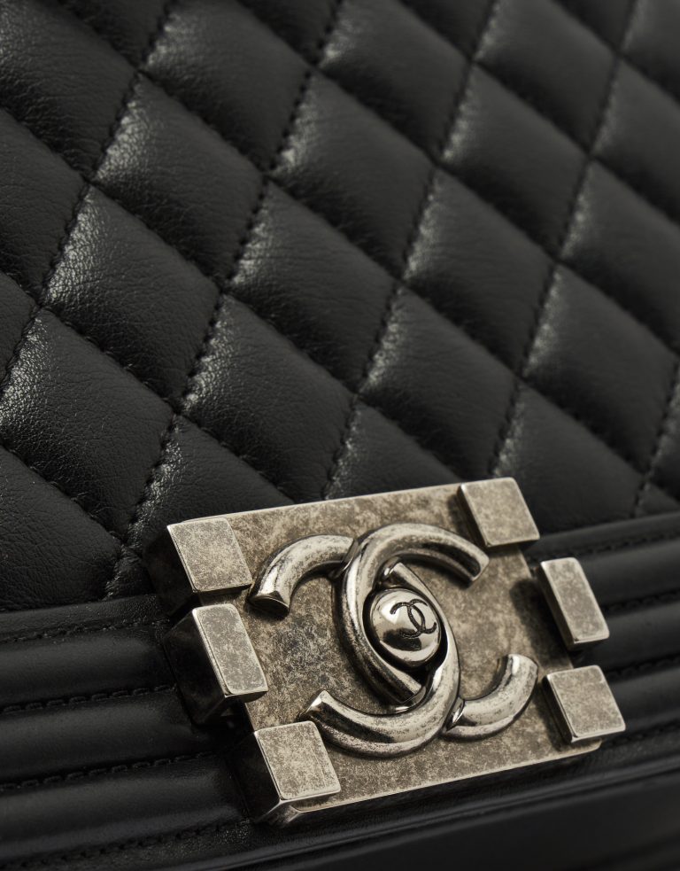 CC Logo Detail on a pre-loved Chanel Boy Medium Lambskin Black on SACLÀB