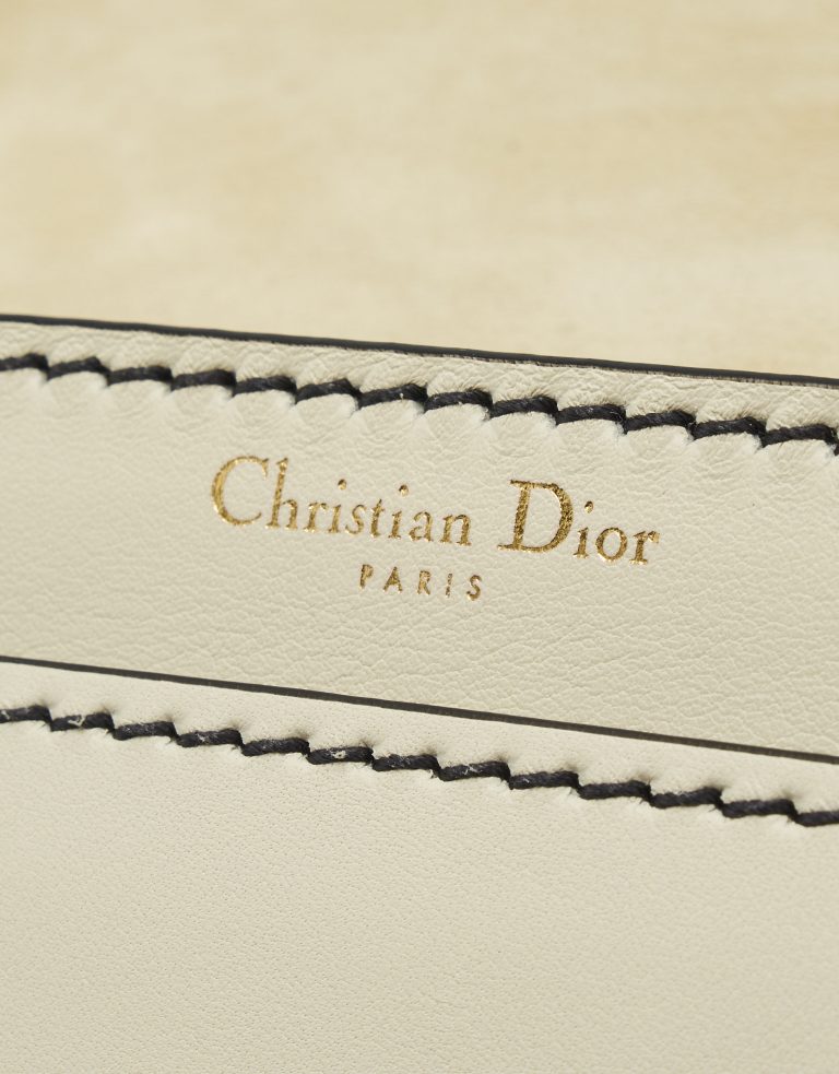 Logo Detail on a pre-loved Dior J'ADIOR Medium Calfskin Beige on SACLÀB