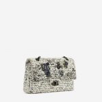 A pre-loved Chanel 2.55 Reissue 226 Tweed White Black Garden Charms on SACLÀB