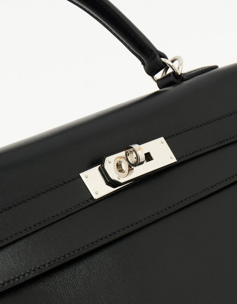 A pre-loved Hermès Kelly 32 Box Leather in Black on SACLÀB