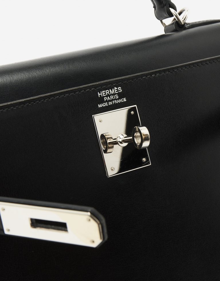 A pre-loved Hermès Kelly 32 Box Leather in Black on SACLÀB