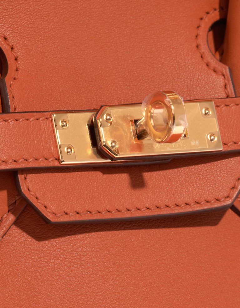 Pre-owned Hermès bag Birkin 25 Swift Terre Battue Brown, Orange, Red Closing System | Sell your designer bag on Saclab.com