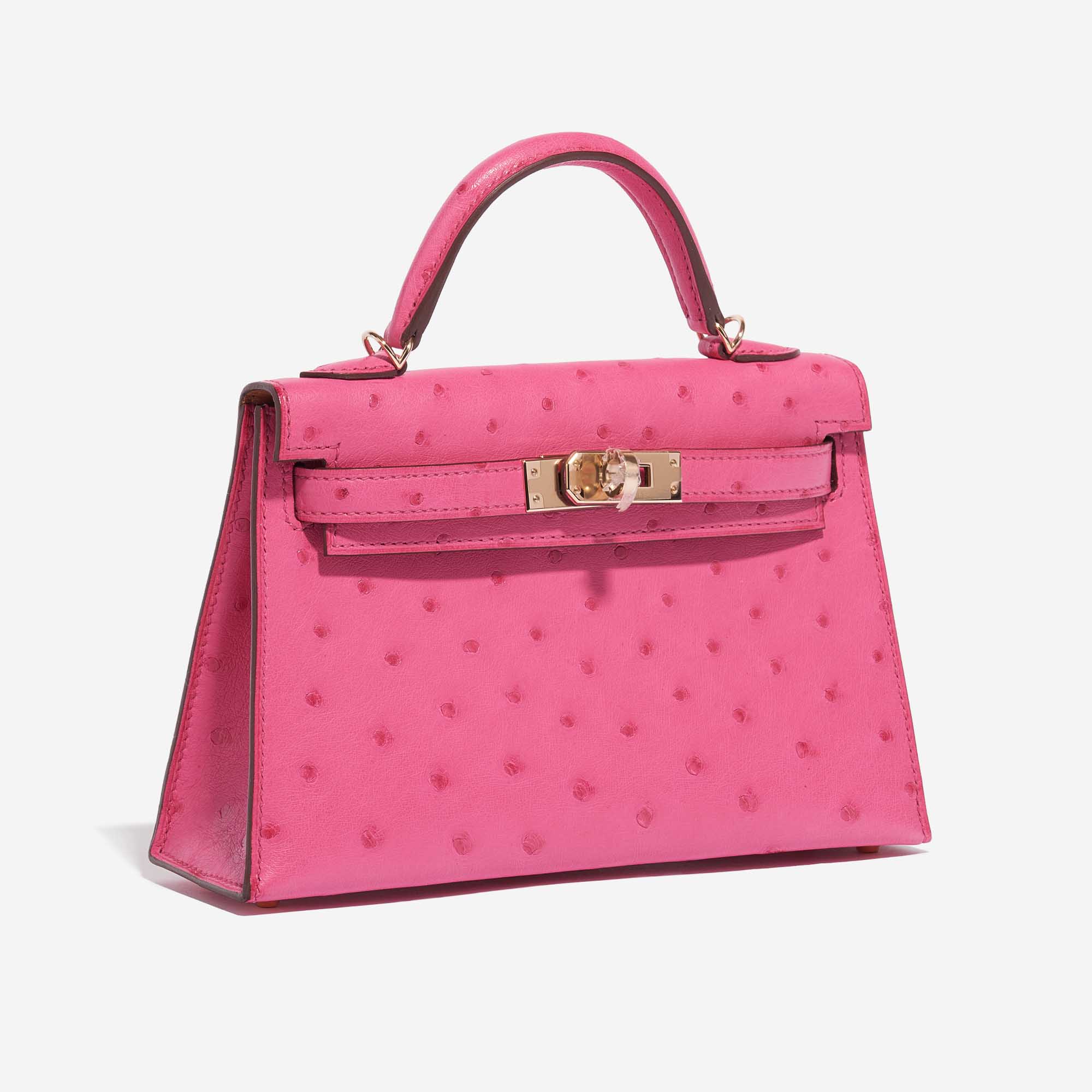 Pre-owned Hermès bag Kelly Mini HSS Ostrich Rose Fuchsia / Gold Pink, Rose Side Front | Sell your designer bag on Saclab.com
