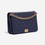 Pre-owned Chanel bag Boy WOC Caviar Blue Blue Side Front | Sell your designer bag on Saclab.com