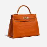 Pre-owned Hermès bag Kelly 32 Porosus Crocodile Pain d’epice Orange Side Front | Sell your designer bag on Saclab.com