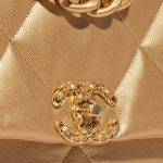 Chanel 19 Flap Bag Maxi Lamb Gold Gold Closing System | Sell your designer bag on Saclab.com