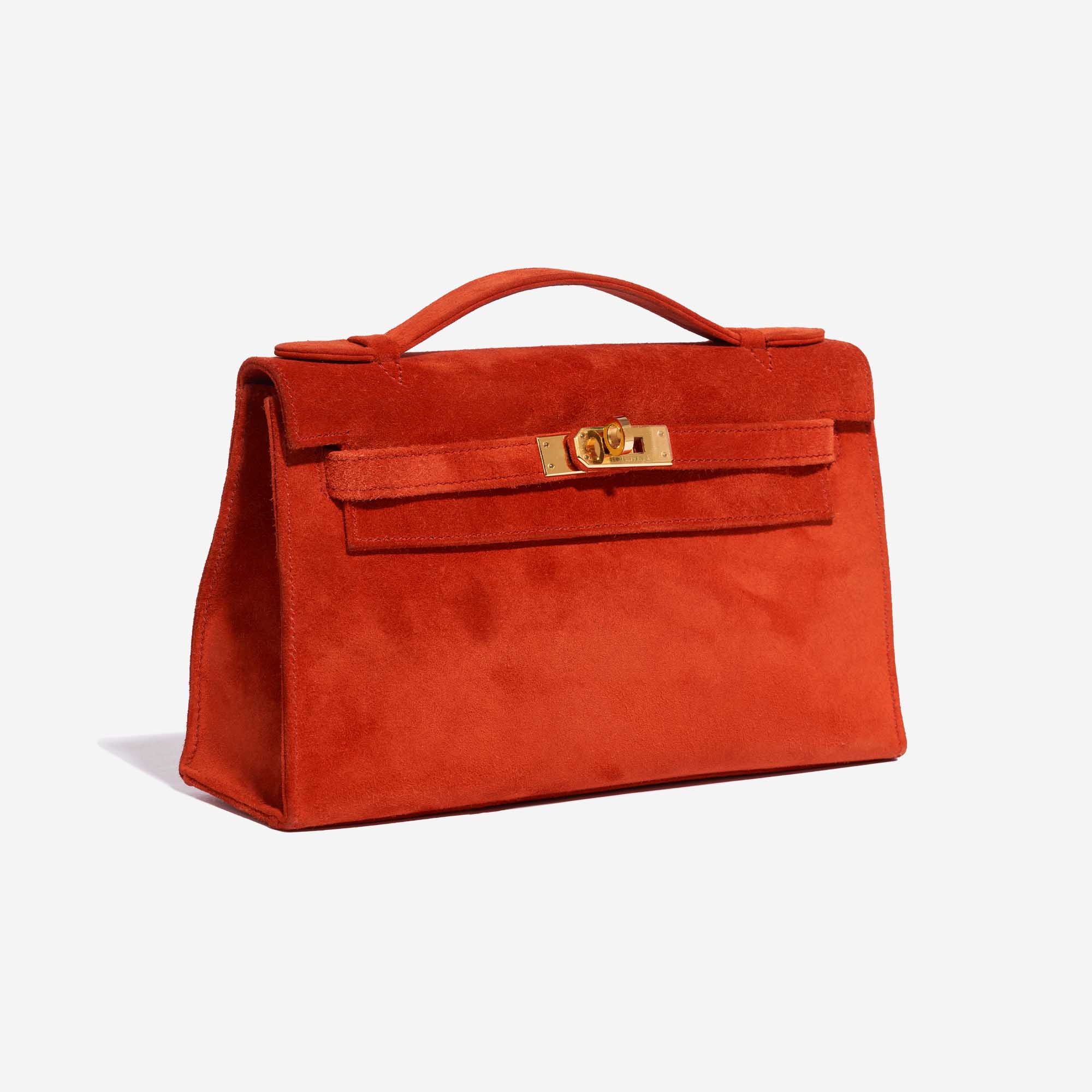 Pre-owned Hermès bag Kelly Pochette Doblis Suede Rouge Vif Red Side Front | Sell your designer bag on Saclab.com