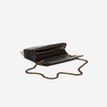 Chanel WOC Lamb Camellia Black / Shimmering Gold Black Inside | Sell your designer bag on Saclab.com
