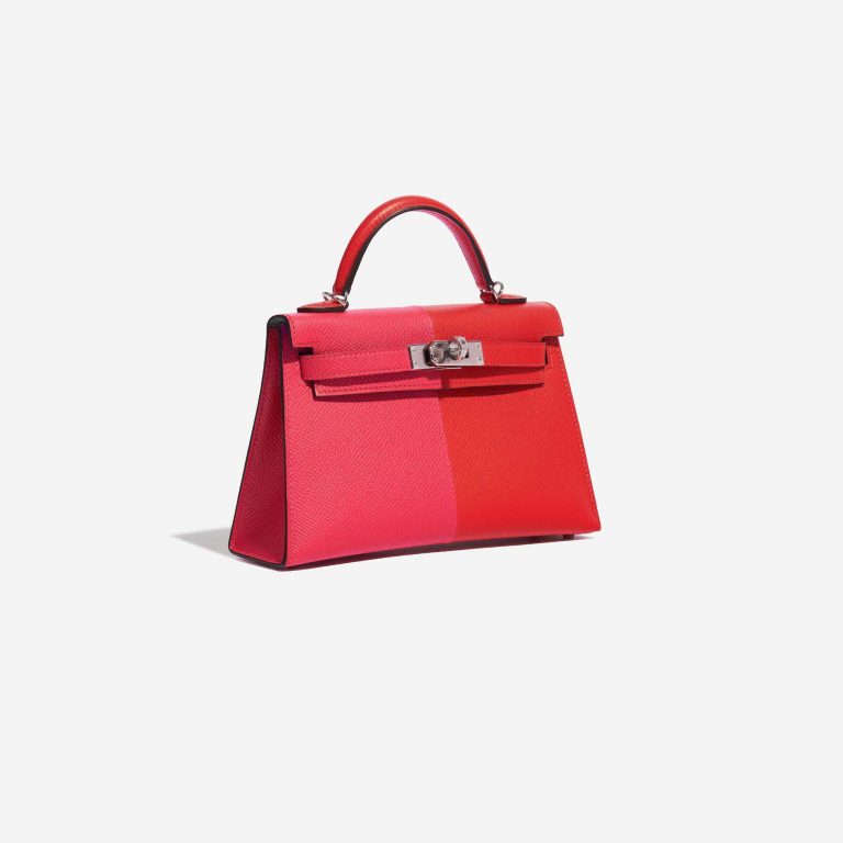 Pre-owned Hermès bag Kelly Mini Epsom Rose Extreme / Rouge de Coeur / Blue Zanzibar Red, Rose Side Front | Sell your designer bag on Saclab.com