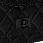 Pre-owned Chanel bag 2.55 Reissue WOC Lambskin Black Black Closing System | Sell your designer bag on Saclab.com
