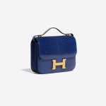 Pre-owned Hermès bag Constance 18 Salvator Lizard Blue Sapphire Blue Side Front | Sell your designer bag on Saclab.com