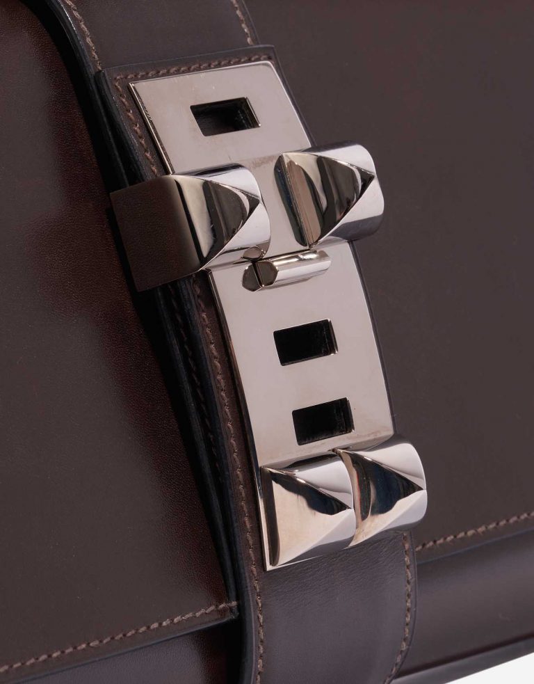 Pre-owned Hermès bag Medor Clutch 29 Swift Chocolat Brown Closing System | Sell your designer bag on Saclab.com