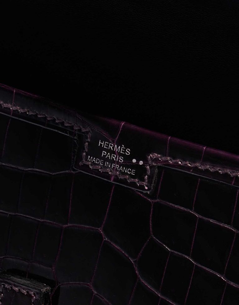 Pre-owned Hermès bag Jige Clutch Shiny Niloticus Crocodile Prunoir Violet Logo | Sell your designer bag on Saclab.com