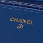 Pre-owned Chanel bag WOC Camellia Lamb Blue Blue Logo | Sell your designer bag on Saclab.com