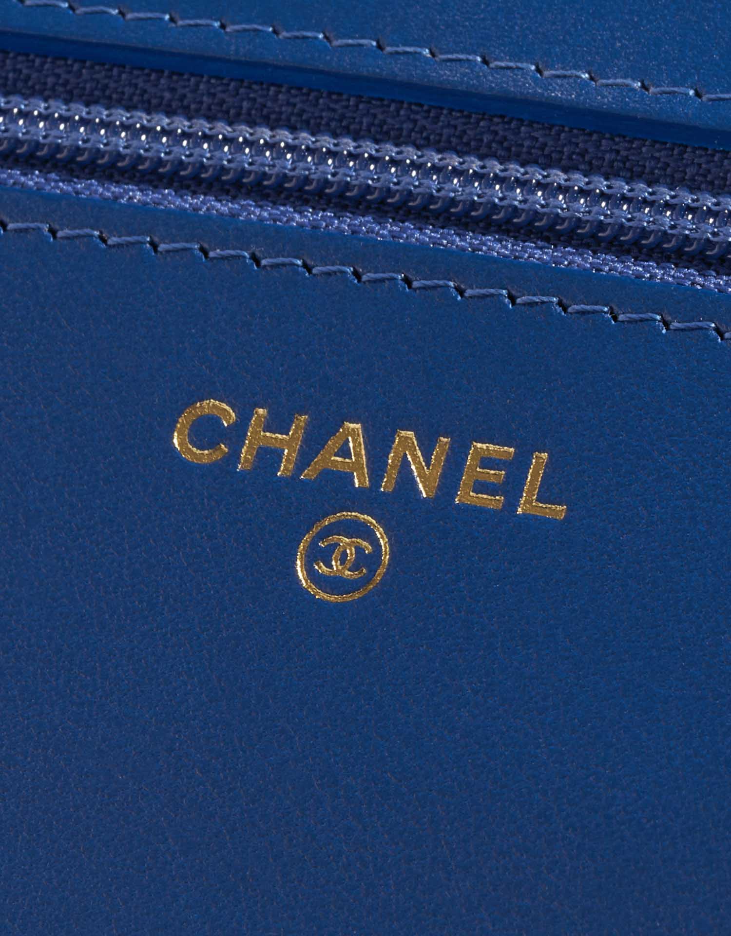 Pre-owned Chanel bag WOC Camellia Lamb Blue Blue Logo | Sell your designer bag on Saclab.com