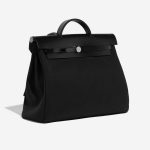 Pre-owned Hermès bag Herbag 39 Vache Hunter / Toile Militaire Black Black Side Front | Sell your designer bag on Saclab.com