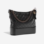 Pre-owned Chanel bag Gabrielle Large Calf Black Black Side Front | Sell your designer bag on Saclab.com