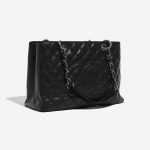 Pre-owned Chanel bag Shopping Tote GST Caviar Black Black Side Front | Sell your designer bag on Saclab.com
