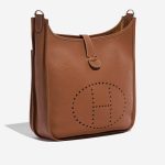 Pre-owned Hermès bag Evelyne 33 Taurillon Clemence Gold Brown Side Front | Sell your designer bag on Saclab.com