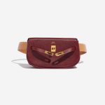 Pre-owned Hermès bag Kelly Pochette Courchevel Bordeaux / Gold Brown, Red Front Open | Sell your designer bag on Saclab.com