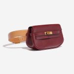 Pre-owned Hermès bag Kelly Pochette Courchevel Bordeaux / Gold Brown, Red Side Front | Sell your designer bag on Saclab.com