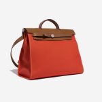 Pre-owned Hermès bag Herbag 39 Vache Hunter / Toile Militaire Capucine / Fauve Orange Side Front | Sell your designer bag on Saclab.com