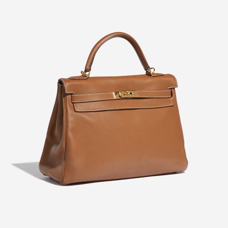 Pre-owned Hermès bag Kelly 32 Togo Gold Brown Side Front | Sell your designer bag on Saclab.com