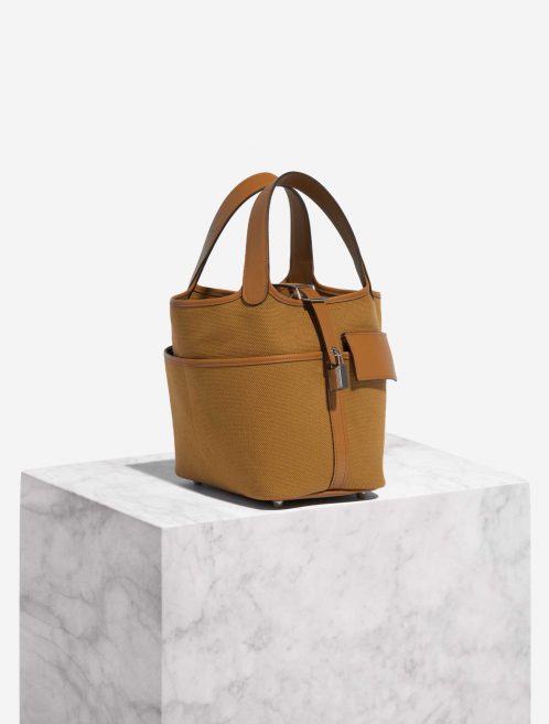 Pre-owned Hermès bag Picotin 18 Canvas Sesame Brown Side Front | Sell your designer bag on Saclab.com