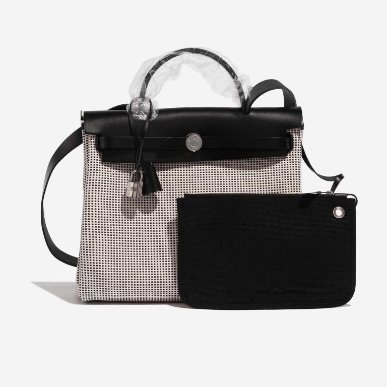 Pre-owned Hermès bag Herbag 31 Toile Quadrille Viking / Vache Hunter Ecru / Black / White Black, White Front | Sell your designer bag on Saclab.com