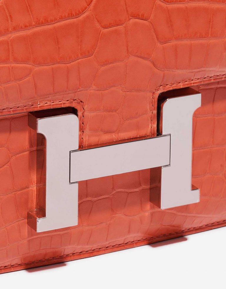 Pre-owned Hermès bag Constance 18 Matte Alligator Orange Poppy Orange Side Front | Sell your designer bag on Saclab.com