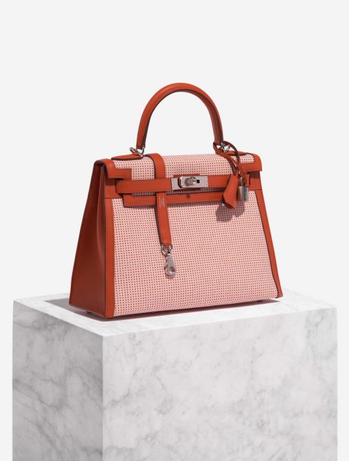 Pre-owned Hermès bag Kelly 28 Toile Quadrille / Swift Terre Battue / Mauve Sylvestre / Blanc Red, Rose, White Side Front | Sell your designer bag on Saclab.com