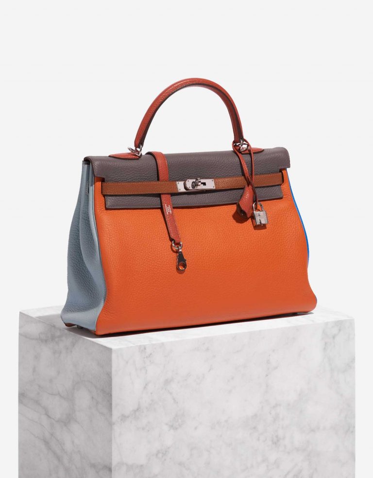 Pre-owned Hermès bag Kelly 35 Harlequin Togo Orange /  Etain / Blue Lin / Sanguine / Blue Hydra / Gold Multicolour Side Front | Sell your designer bag on Saclab.com