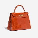 Pre-owned Hermès bag Kelly 28 Porosus Crocodile Orange H Orange Side Front | Sell your designer bag on Saclab.com