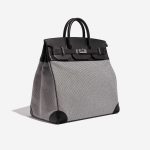Pre-owned Hermès bag Haut à Courroies 40 Toile Criss / Veau Evergrain Black / Ecru Grey Side Front | Sell your designer bag on Saclab.com