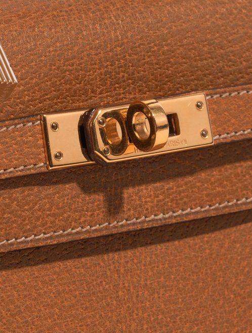 Pre-owned Hermès bag Kelly Mini Porc Gold Brown Closing System | Sell your designer bag on Saclab.com