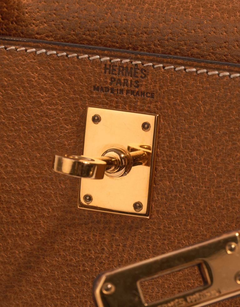 Pre-owned Hermès bag Kelly Mini Porc Gold Brown Logo | Sell your designer bag on Saclab.com